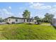 Spacious backyard with a seating area, providing an inviting outdoor space at 2715 Herwald St, Sarasota, FL 34231