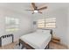 Bright bedroom with white walls, wood-look floors, and a modern ceiling fan at 2715 Herwald St, Sarasota, FL 34231