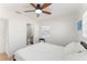 Bright bedroom with a ceiling fan and an en-suite bathroom with marble tile at 2715 Herwald St, Sarasota, FL 34231