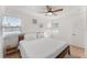 Bright bedroom with white walls, wood-look floors, and a modern ceiling fan at 2715 Herwald St, Sarasota, FL 34231