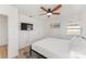 Bright bedroom with a ceiling fan, built-in closet, and a contemporary design at 2715 Herwald St, Sarasota, FL 34231