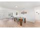 Dining area with a large table and an inviting living room creating a functional and open living space at 2715 Herwald St, Sarasota, FL 34231
