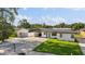 Well-maintained home featuring fresh white paint, a carport, and a spacious yard in a desirable location at 2715 Herwald St, Sarasota, FL 34231