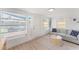 Cozy living room with light wood floors, neutral walls, and comfortable seating at 2715 Herwald St, Sarasota, FL 34231