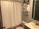 Clean bathroom featuring a white vanity, linen closet, and shower with modern fixtures at 2722 9Th Ave W, Bradenton, FL 34205