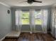 Inviting bedroom featuring hardwood floors, neutral paint, and bright windows at 2722 9Th Ave W, Bradenton, FL 34205