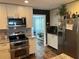 Contemporary kitchen featuring stainless appliances, granite countertops and modern white cabinets at 2722 9Th Ave W, Bradenton, FL 34205