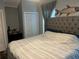 Serene main bedroom featuring a decorative headboard, closet and hardwood floors at 2722 9Th Ave W, Bradenton, FL 34205