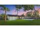 The backyard features a pool with a screened in patio perfect for entertaining and relaxing with friends and Gathering at 2915 Woodpine Cir, Sarasota, FL 34231