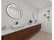 Stylish bathroom with double vanity, modern lighting, and sleek fixtures at 2915 Woodpine Cir, Sarasota, FL 34231