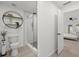 Modern bathroom featuring a glass-enclosed shower, decorative plants, and a toilet at 2915 Woodpine Cir, Sarasota, FL 34231