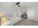 Cozy bedroom featuring a modern ceiling fan, decor, neutral tones, and closet for storage and comfort at 2915 Woodpine Cir, Sarasota, FL 34231