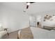 Airy bedroom featuring backyard views, minimalist decor, and light-colored walls at 2915 Woodpine Cir, Sarasota, FL 34231