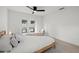 Relaxing bedroom with neutral decor, backyard views, and natural light at 2915 Woodpine Cir, Sarasota, FL 34231