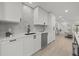 Modern kitchen with white cabinets, stainless steel appliances, and an open layout at 2915 Woodpine Cir, Sarasota, FL 34231