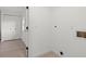 Bright laundry area with modern flooring, washer/dryer hookups, and convenient closet space for efficient home management at 2915 Woodpine Cir, Sarasota, FL 34231