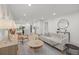 Open concept living room flows into a modern kitchen with an island and bar seating at 2915 Woodpine Cir, Sarasota, FL 34231