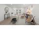 Bright living room featuring modern decor, light wood floors, and access to a patio at 2915 Woodpine Cir, Sarasota, FL 34231