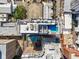 Overhead view of a building rooftop featuring a pool and lounge area in an urban setting at 33 S Palm Ave # 1202, Sarasota, FL 34236