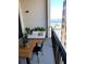 Comfortable balcony setup featuring a couch and table with a view of the water at 33 S Palm Ave # 1202, Sarasota, FL 34236