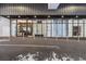 Modern building entrance featuring glass doors, sleek design, and designated parking, creating a welcoming arrival experience at 33 S Palm Ave # 1202, Sarasota, FL 34236