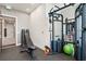 Features a weight training station with free weights, a bench, a rubber floor, and access to the rest of the home at 33 S Palm Ave # 1202, Sarasota, FL 34236