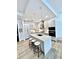 Modern kitchen features stainless steel appliances, a spacious island, and stylish pendant lighting at 33 S Palm Ave # 1202, Sarasota, FL 34236