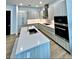 Well-equipped kitchen featuring stainless steel appliances, an island, and ample cabinet space at 33 S Palm Ave # 1202, Sarasota, FL 34236