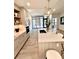 Bright kitchen with sleek countertops, island seating, and an open view to the balcony at 33 S Palm Ave # 1202, Sarasota, FL 34236