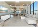 Bright and airy living room open to the dining area and kitchen, featuring modern decor and ample natural light at 33 S Palm Ave # 1202, Sarasota, FL 34236