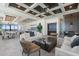 Spacious living area with comfortable seating, coffered ceiling, and open layout to the dining and kitchen areas at 33 S Palm Ave # 1202, Sarasota, FL 34236