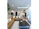 Spacious living room with an open layout, modern decor, and a view into the kitchen at 33 S Palm Ave # 1202, Sarasota, FL 34236