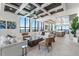 Spacious living room with floor-to-ceiling windows, modern furniture, and an open floor plan at 33 S Palm Ave # 1202, Sarasota, FL 34236