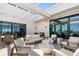 Inviting outdoor patio space with comfortable seating, dining area, and ample natural light at 33 S Palm Ave # 1202, Sarasota, FL 34236