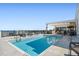 Inviting rooftop pool with lounge chairs, and shaded area offering relaxation with a scenic backdrop at 33 S Palm Ave # 1202, Sarasota, FL 34236