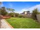 Expansive backyard with mature trees, providing ample space for outdoor activities and relaxation at 3910 77Th E Pl, Sarasota, FL 34243