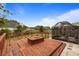 Wooden deck with a screened-in porch in a backyard, perfect for outdoor living at 3910 77Th E Pl, Sarasota, FL 34243