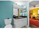 Bathroom featuring a granite countertop vanity and modern fixtures, exuding elegance at 3910 77Th E Pl, Sarasota, FL 34243