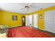 Spacious bedroom with an eye-catching rug and a ceiling fan for air circulation at 3910 77Th E Pl, Sarasota, FL 34243