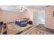 Bedroom with two rugs, a bed, and soft colors, creating a comfortable and relaxing retreat at 3910 77Th E Pl, Sarasota, FL 34243