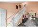 Welcoming entryway boasting a staircase, decor, and an open view into the adjacent dining area at 3910 77Th E Pl, Sarasota, FL 34243