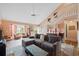 Bright living room with staircase, comfortable seating, wood floors, and view of entry at 3910 77Th E Pl, Sarasota, FL 34243