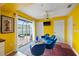Bright living space with a ceiling fan, flat screen TV, and sliding glass doors to the patio at 3910 77Th E Pl, Sarasota, FL 34243