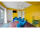 Bright living space has a ceiling fan, colorful walls, and sliding doors to the outside at 3910 77Th E Pl, Sarasota, FL 34243