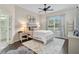 Inviting bedroom featuring a ceiling fan and a large window for natural light at 4103 61St E Ave, Bradenton, FL 34203