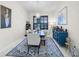 Dining room with tiled floors, modern chandelier and contemporary decor at 4103 61St E Ave, Bradenton, FL 34203
