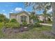 Charming home with a neatly landscaped front yard, featuring mature trees and shrubs for added curb appeal at 4103 61St E Ave, Bradenton, FL 34203