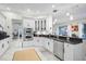 Bright, updated kitchen features stainless steel appliances and white cabinetry at 4103 61St E Ave, Bradenton, FL 34203