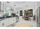 Open kitchen area with granite countertops, pendant lighting, and stainless steel appliances at 4103 61St E Ave, Bradenton, FL 34203