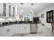 Modern kitchen with granite counters, stainless steel appliances, and eat-in area at 4103 61St E Ave, Bradenton, FL 34203